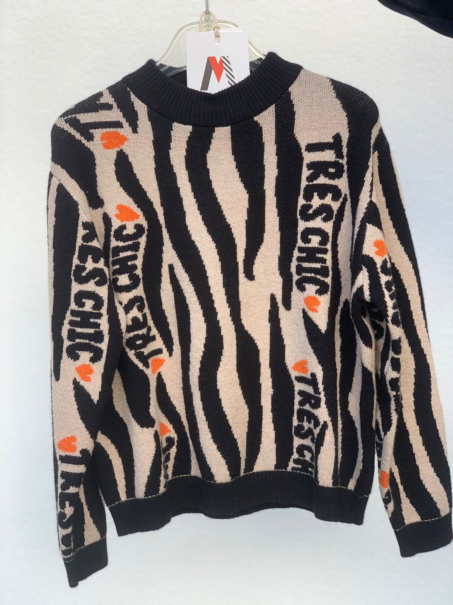 Maglione beige e nero